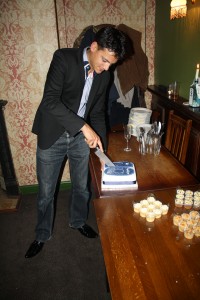 Web-Translations’ MD Daniel cuts the 10-year anniversary cake to share with staff, clients and suppliers