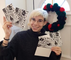 Marina holding her homemade Christmas cards