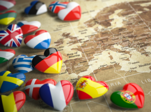 Heart-shaped counters with flags of European countries, placed on a map of Europe