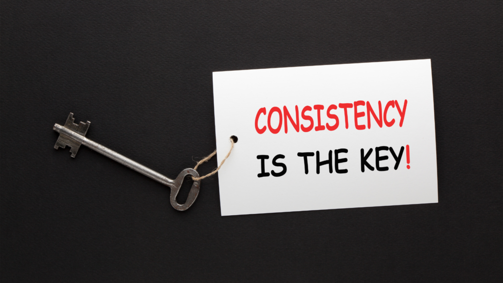 Key with label reading "consistency is the key"